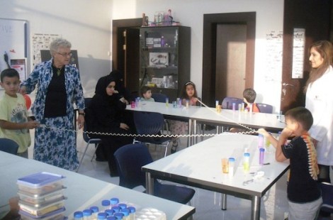 Visiting forensic scientist, Professor Valerie Corfield, explains the intricacies of the DNA spiral to young visitors to the Bahrain Science Centre during a 'DNA Detective' workshop